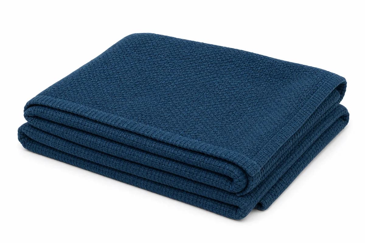 Harbor Weave Throw, 50 x 60 Inches in deep tidal blue — studio product photograph